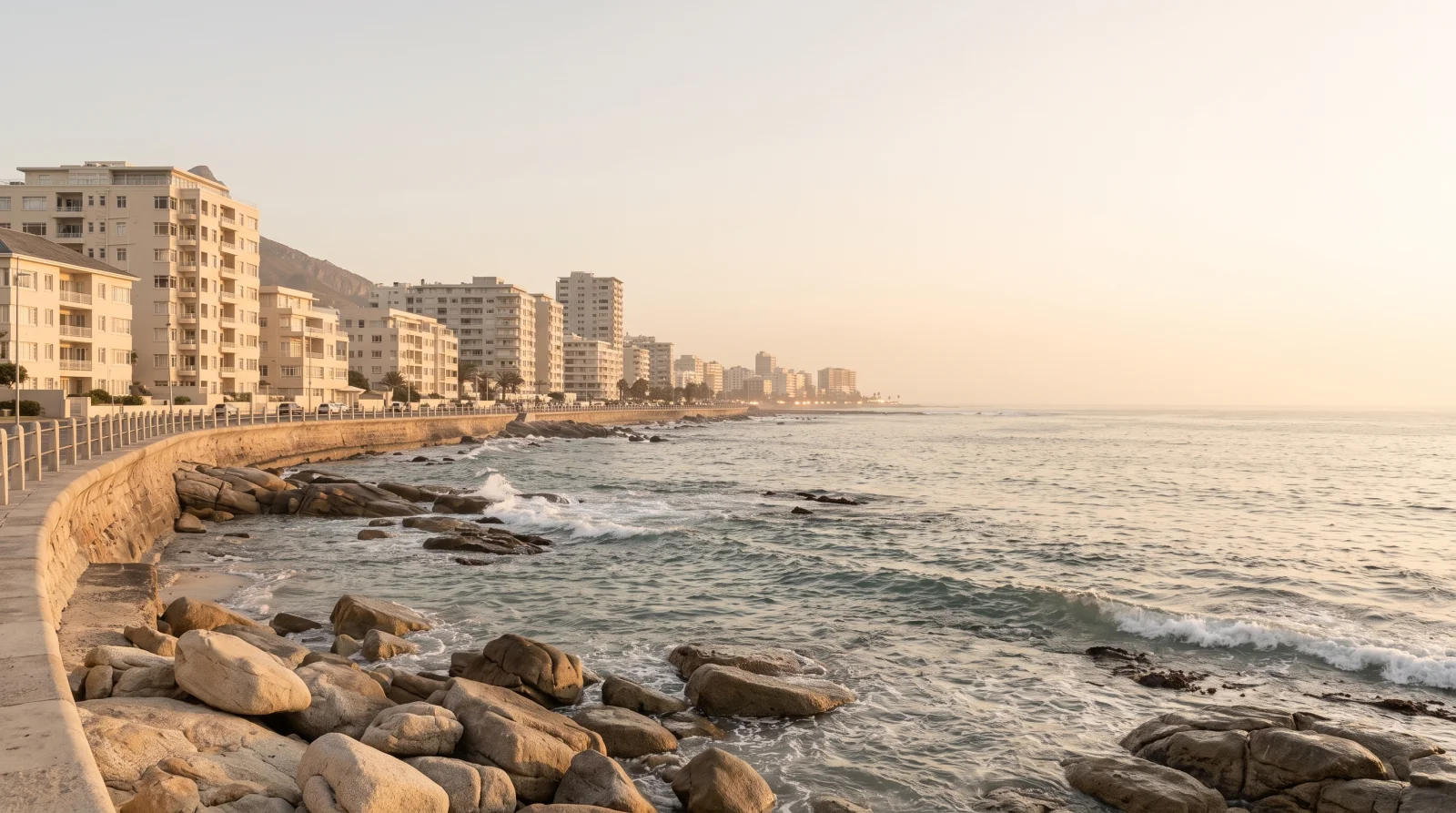 Warm golden-hour view of the Sea Point coastline in Cape Town